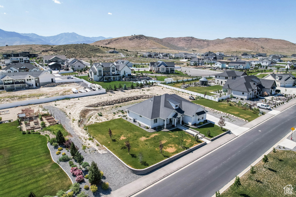 Aerial view of residential area featuring a mountain backdrop