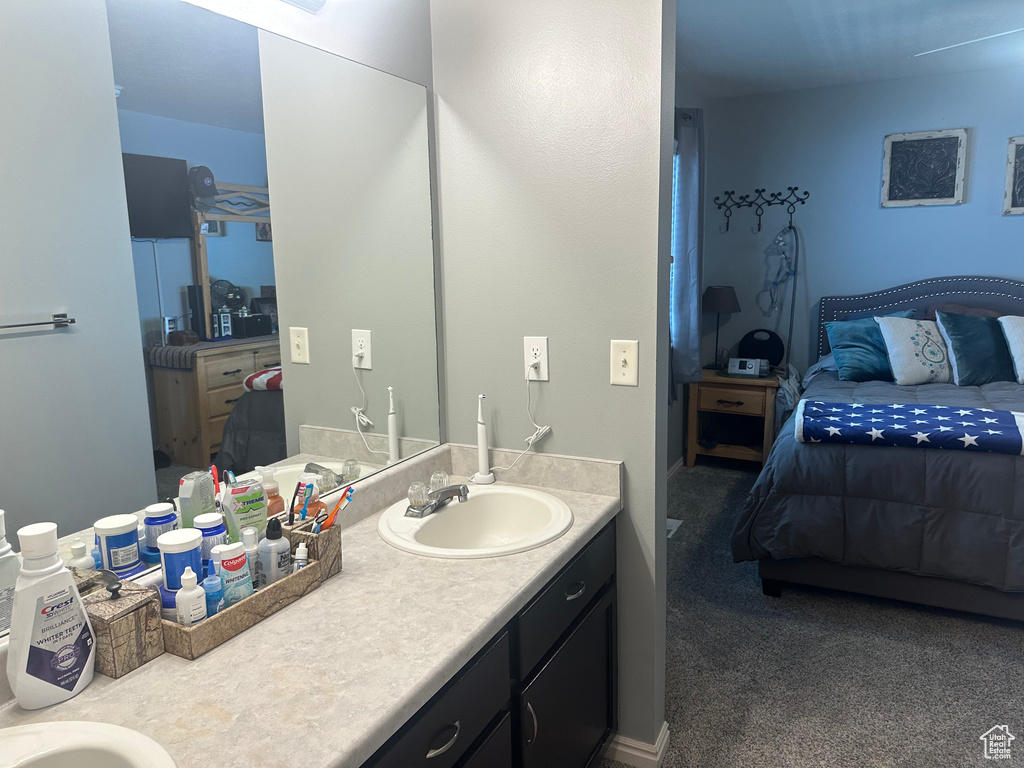 Ensuite bathroom featuring double vanity