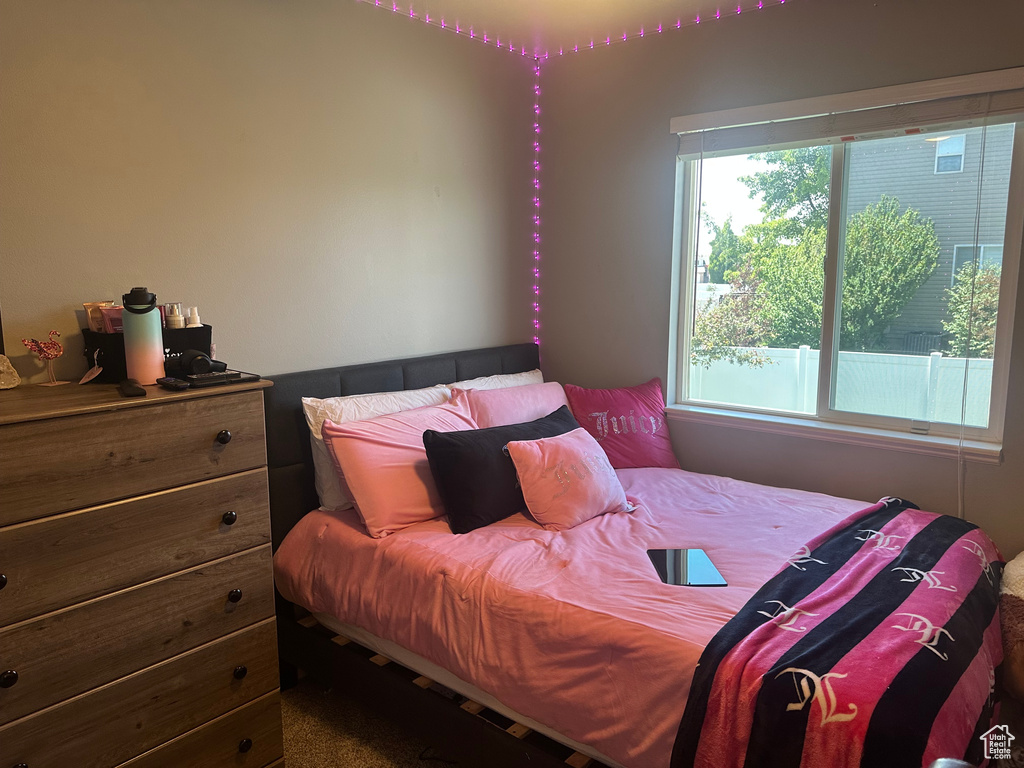 Bedroom with multiple windows
