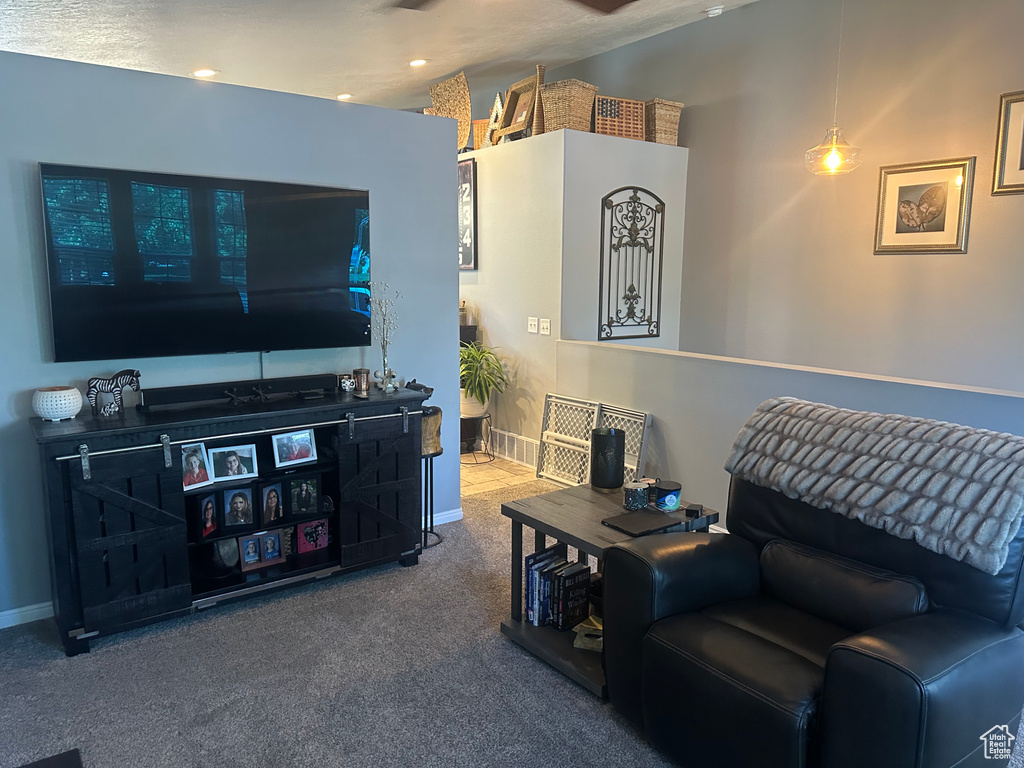 Living room with carpet, baseboards, and recessed lighting