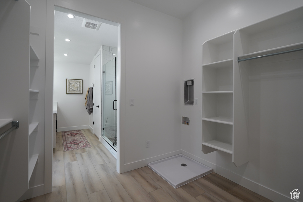 Mudroom with light wood-type flooring, baseboards, and recessed lighting