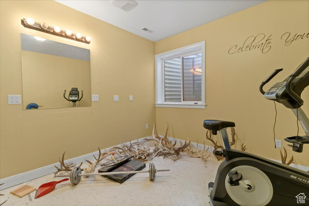 Exercise room featuring baseboards