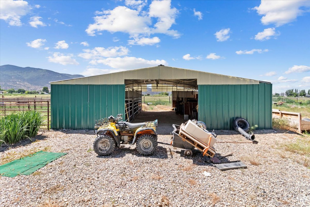 View of outbuilding with an exterior structure and a mountain view