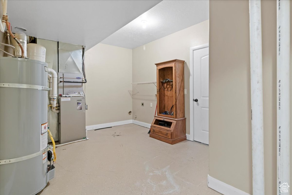 Utility room with strapped water heater