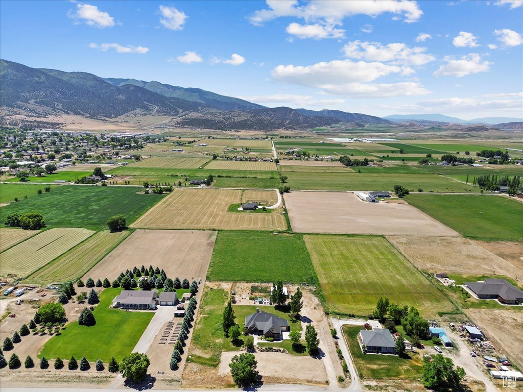 Aerial view of sparsely populated area featuring abundant farmland and mountains