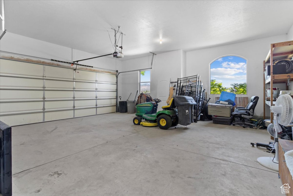 Garage featuring a garage door opener