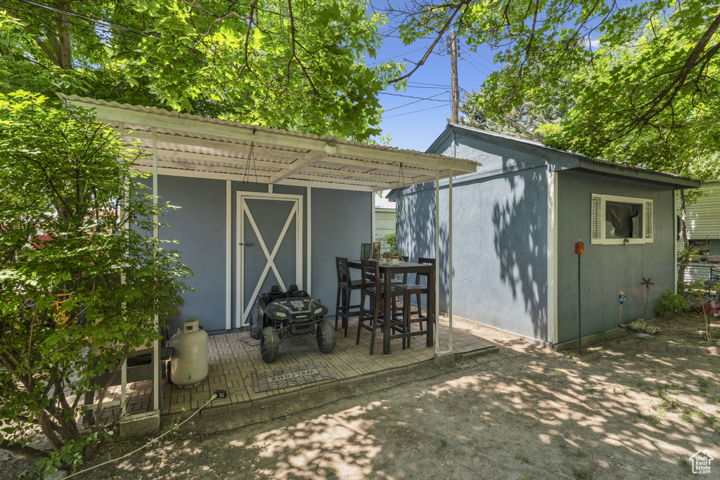 View of shed with outdoor dining area