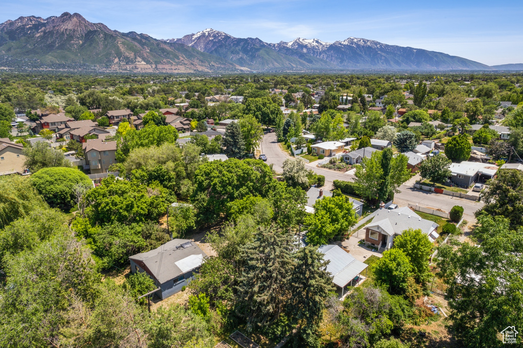 Aerial perspective of suburban area with a mountainous background