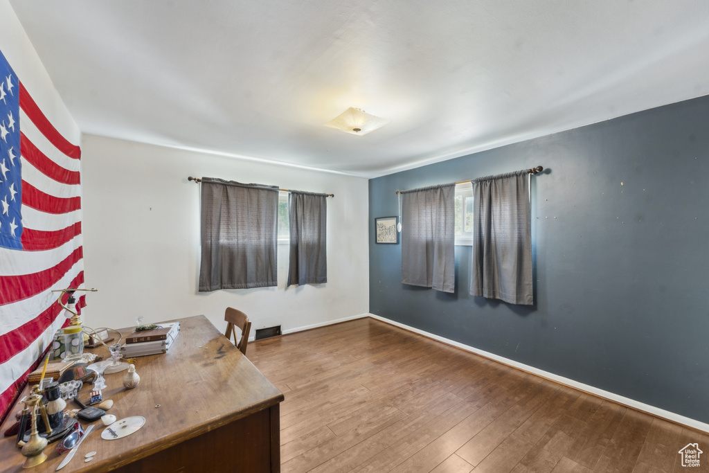 Office featuring wood finished floors and baseboards