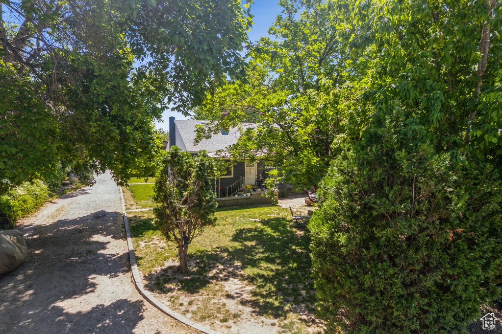 View of front of property with a shingled roof