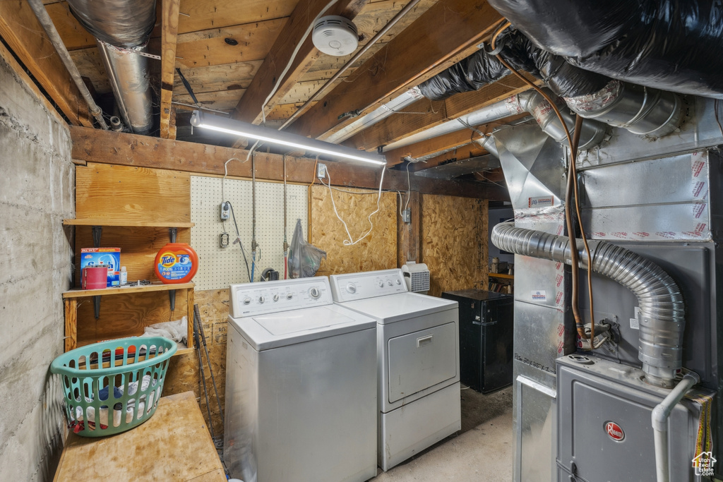 Laundry area with washing machine and clothes dryer