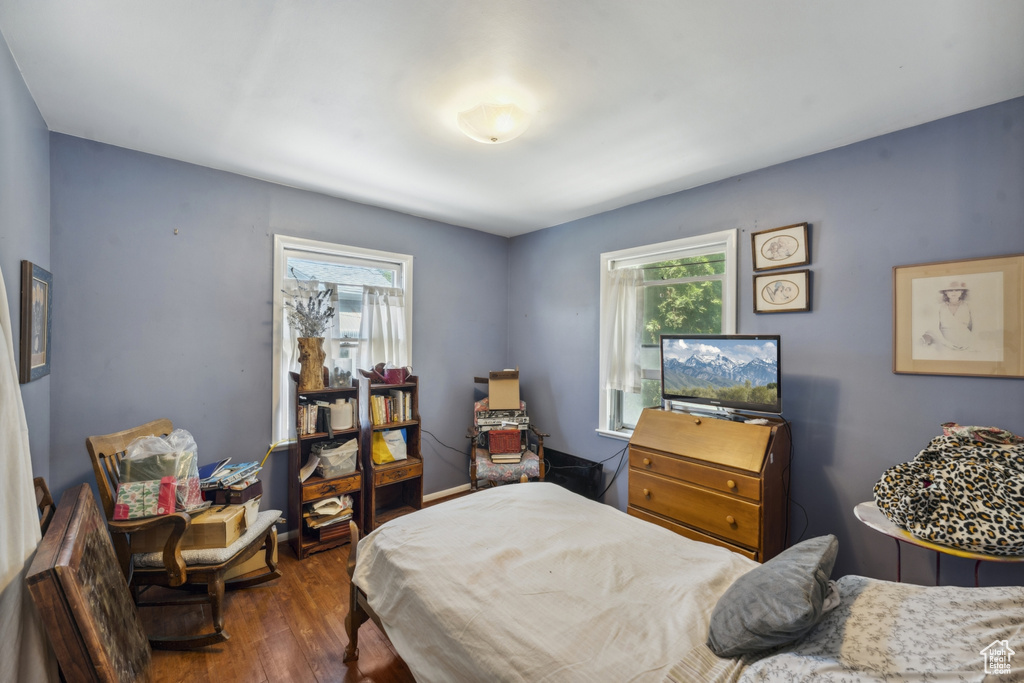Bedroom featuring dark wood-style flooring