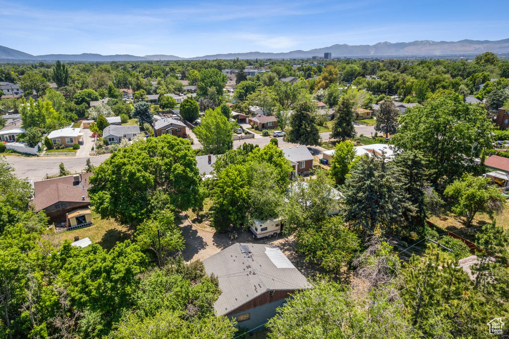 Aerial perspective of suburban area featuring a mountain backdrop