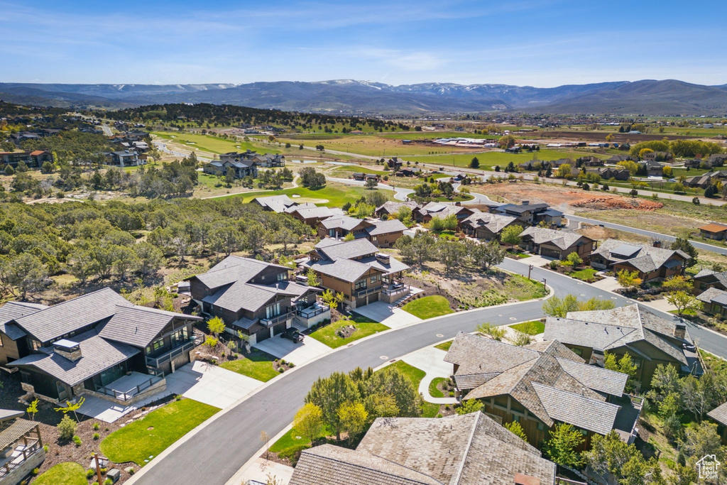 Aerial perspective of suburban area with a mountain backdrop