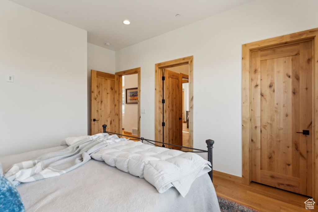 Bedroom featuring light wood-type flooring and recessed lighting