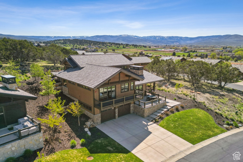 View of subject property featuring mountains