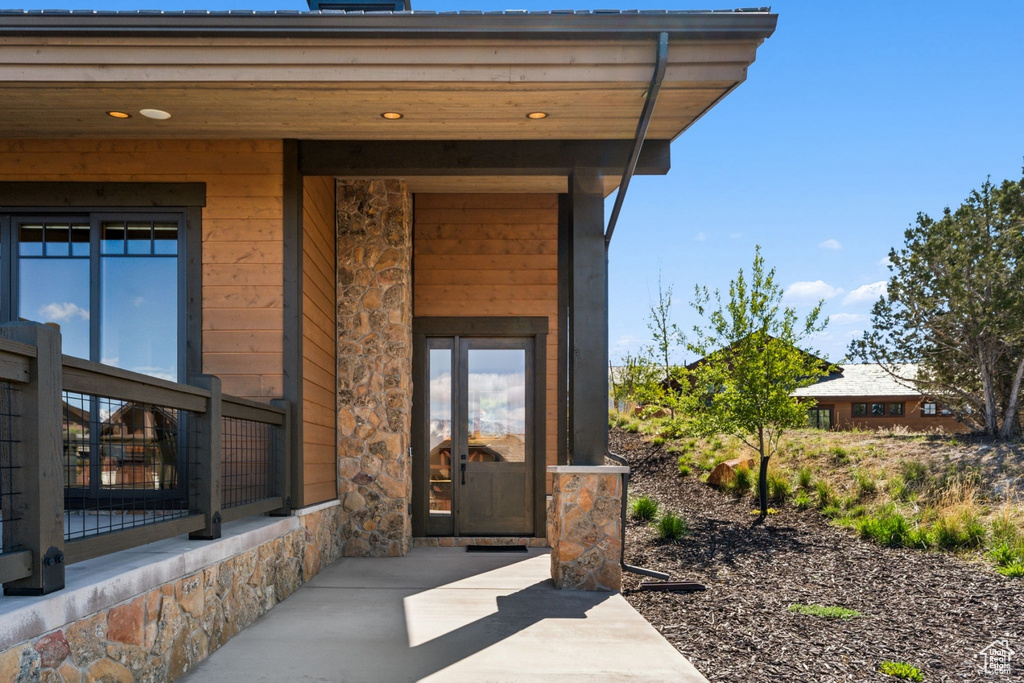 View of exterior entry with stone siding