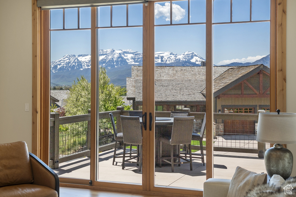 Doorway to outside featuring a mountain view