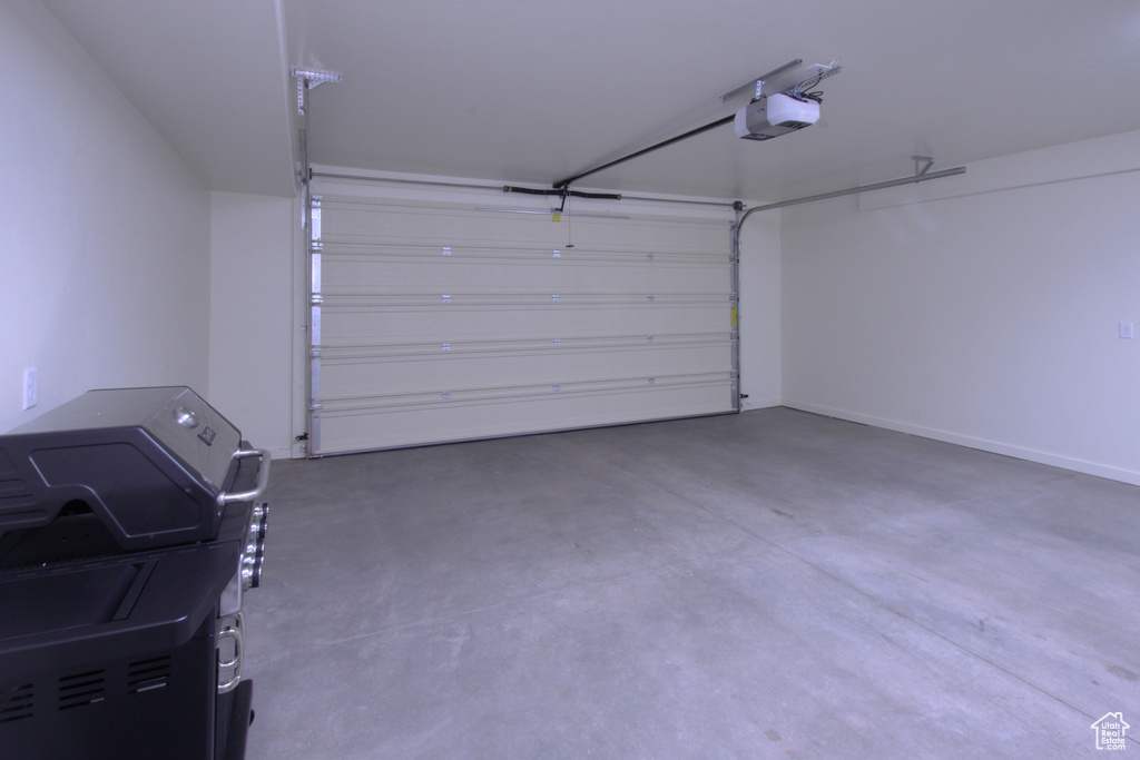 Garage featuring a garage door opener