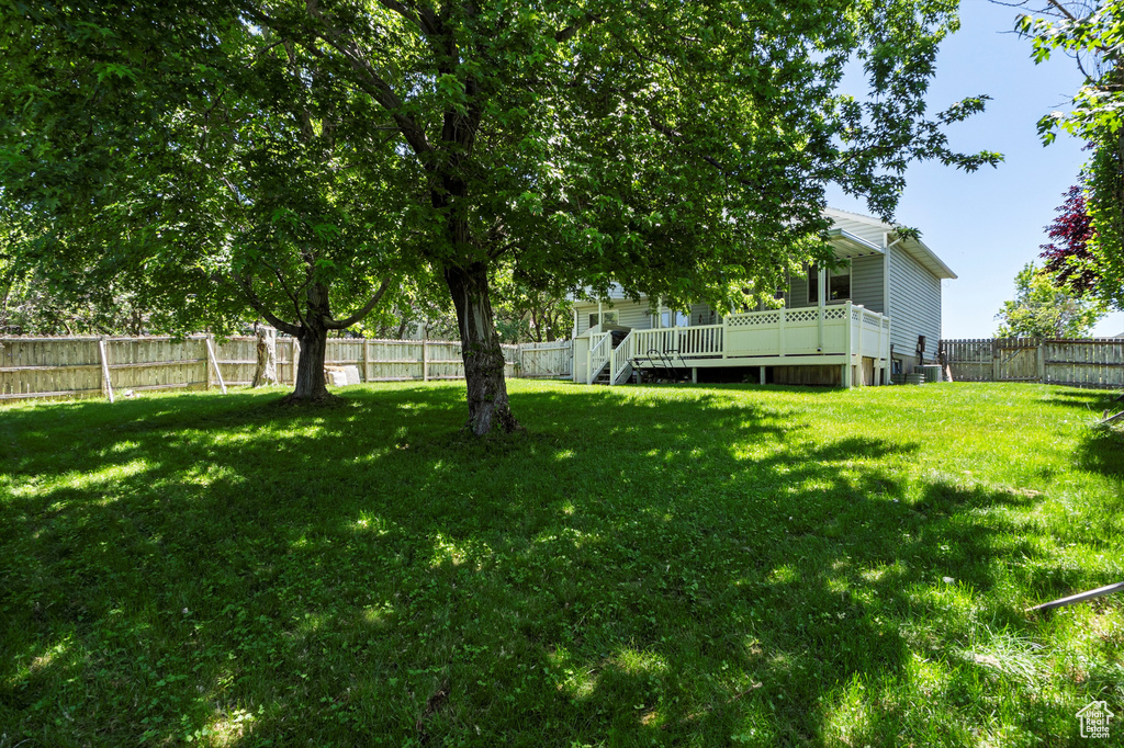 View of yard with a deck