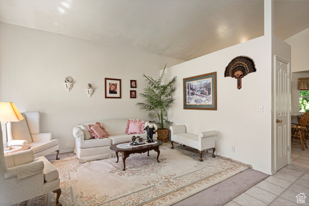 Living room with baseboards and light tile patterned flooring
