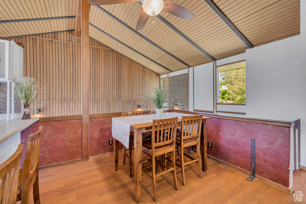 Dining area featuring wood finished floors, ceiling fan, wooden ceiling, and baseboards