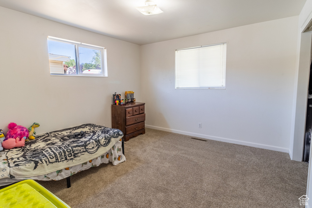 Bedroom with carpet and baseboards