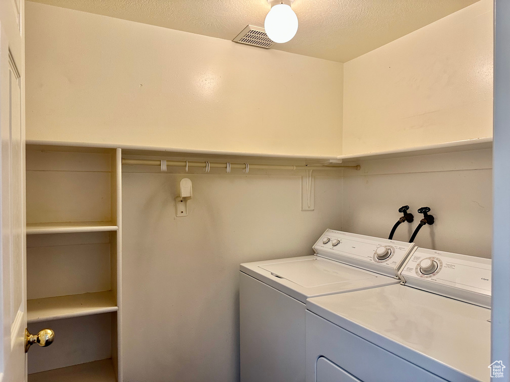 Laundry area featuring separate washer and dryer