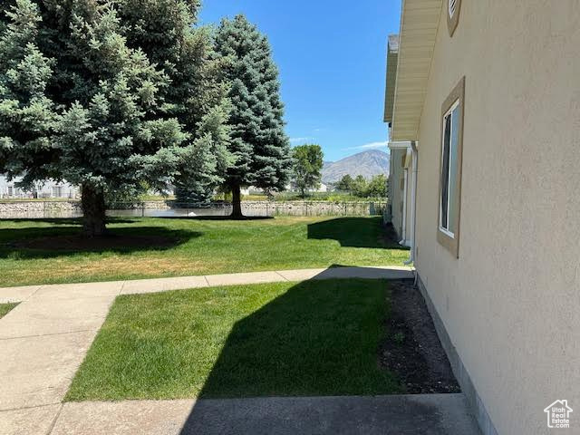 View of green lawn with a mountain view