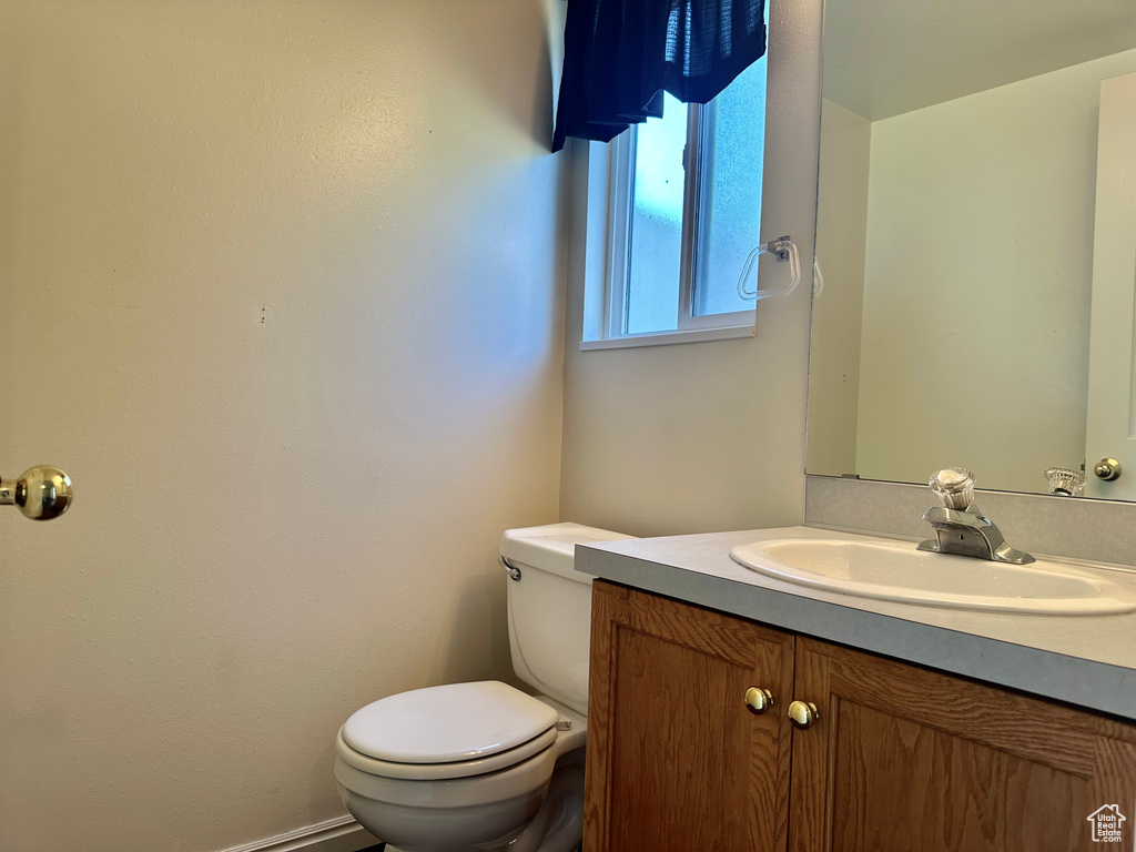 Bathroom with toilet and vanity