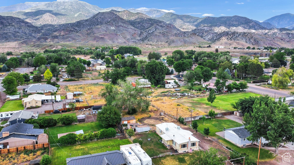 View of property location featuring mountains and nearby suburban area