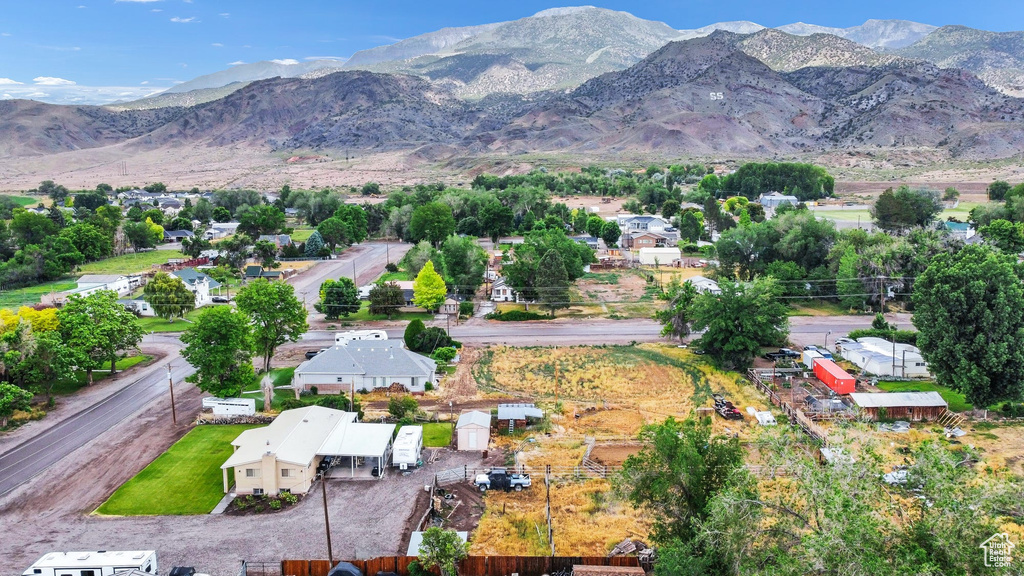 Aerial overview of property\'s location featuring a mountainous background