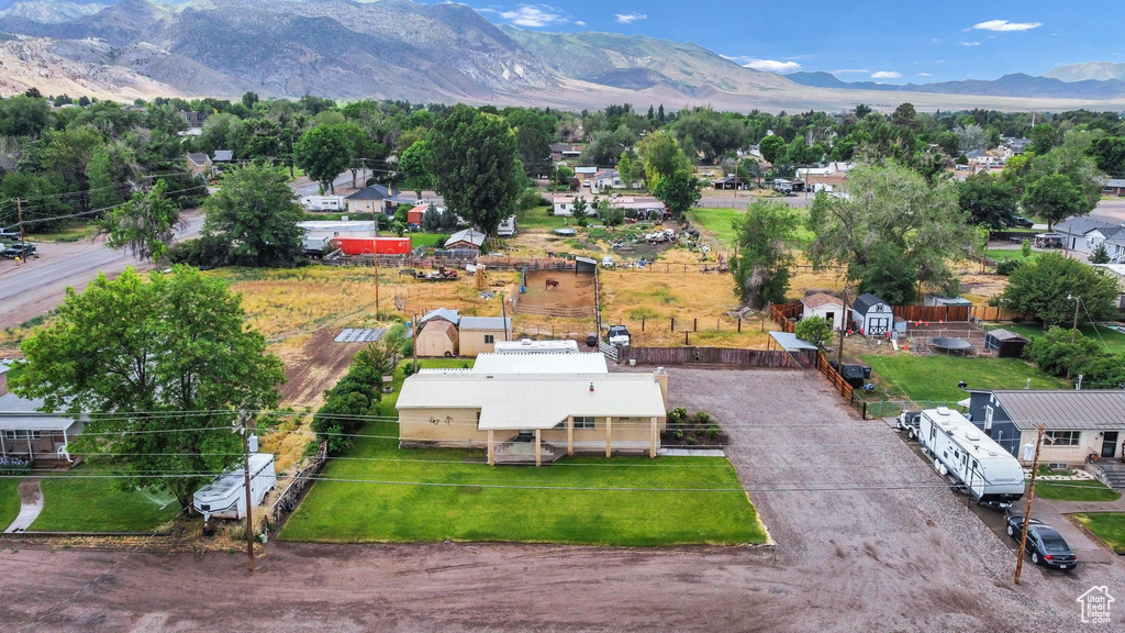 Aerial view of residential area featuring a mountainous background