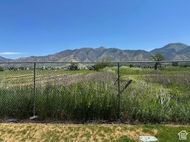 View of mountain background featuring rural landscape
