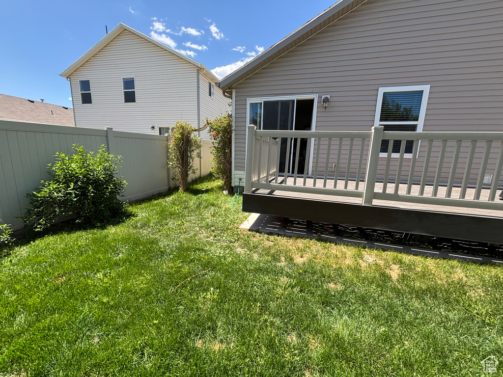Back of house featuring a deck