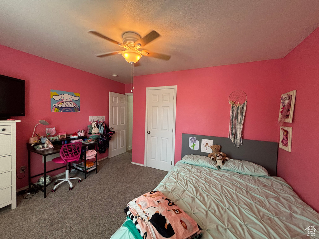 Bedroom with carpet and a ceiling fan