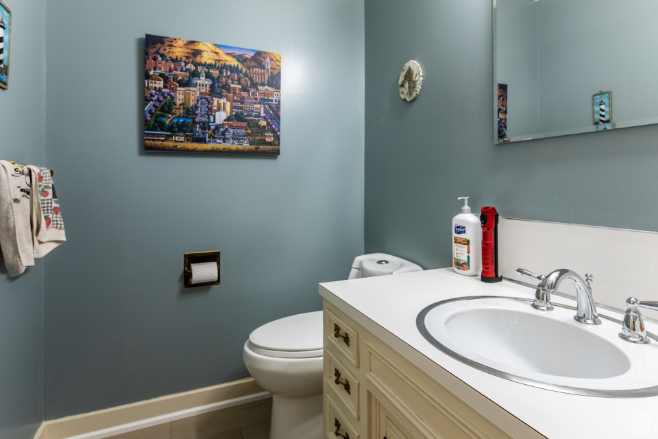 Half bath with toilet and vanity