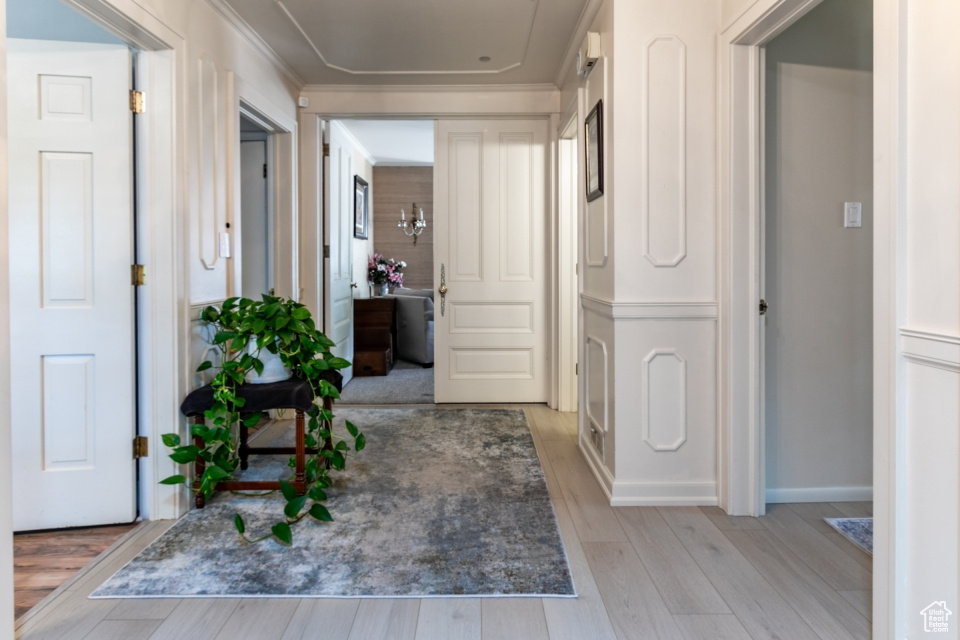 Hallway with light wood-style flooring