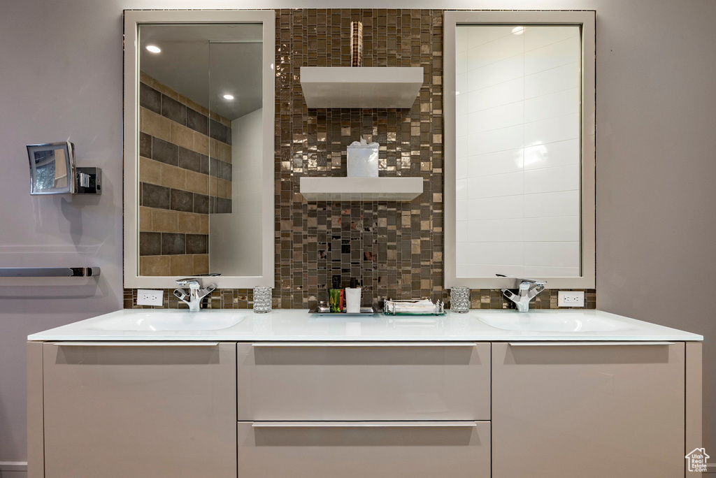 Full bath featuring double vanity