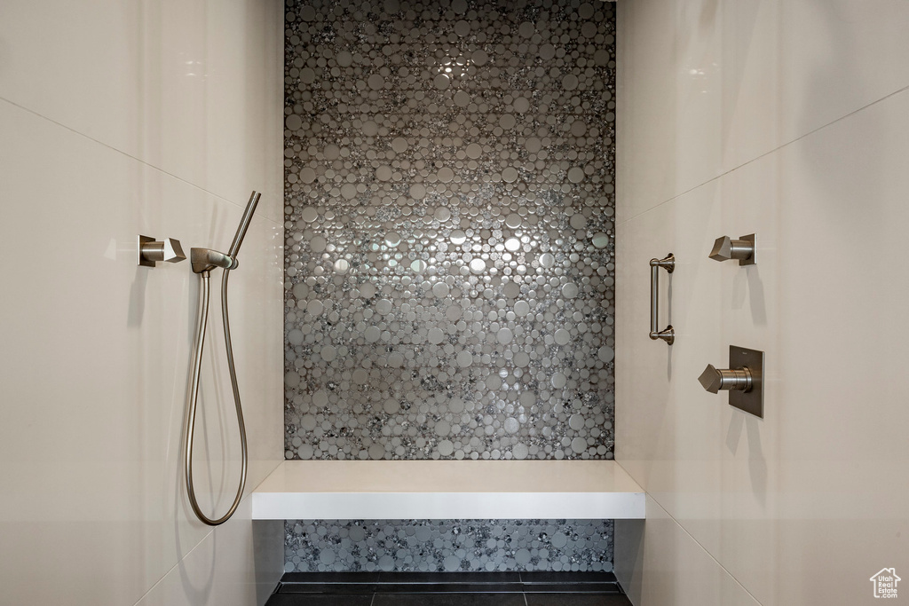Bathroom featuring a tile shower