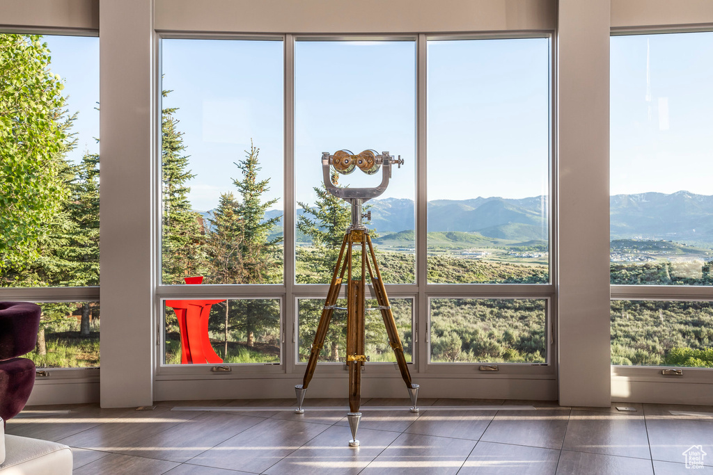 Unfurnished sunroom with a mountain view