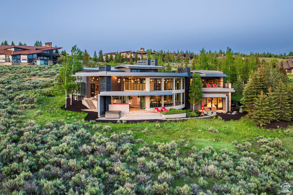Back of property featuring a wooden deck