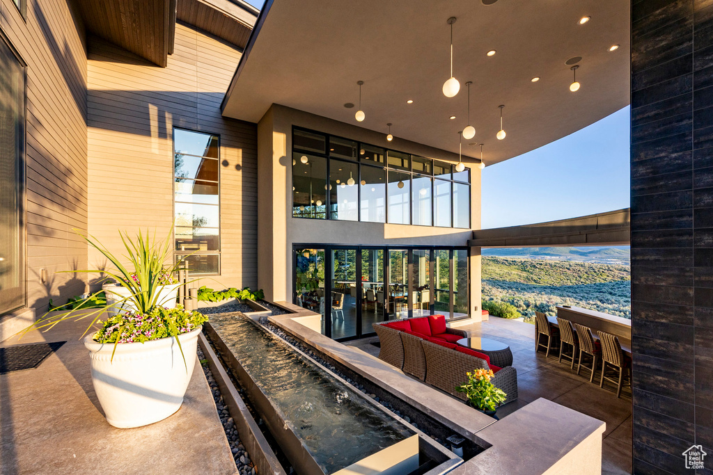 View of patio featuring exterior bar and outdoor lounge area