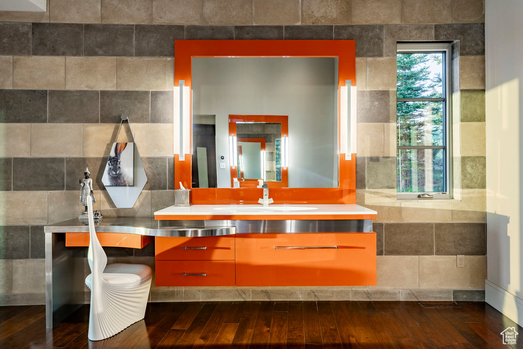 Bathroom featuring wood finished floors and vanity
