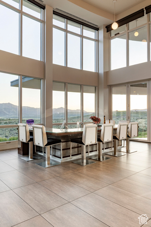 Lobby featuring a towering ceiling and a mountain view