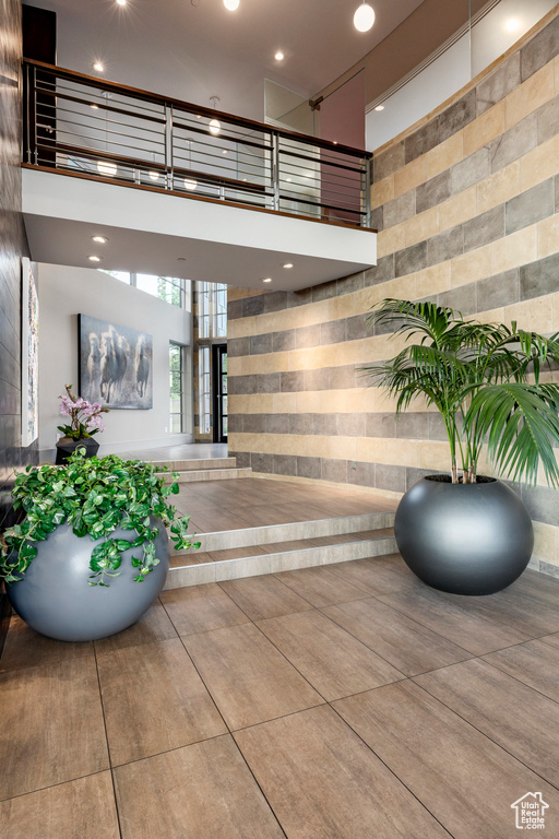 Building lobby with a towering ceiling and recessed lighting