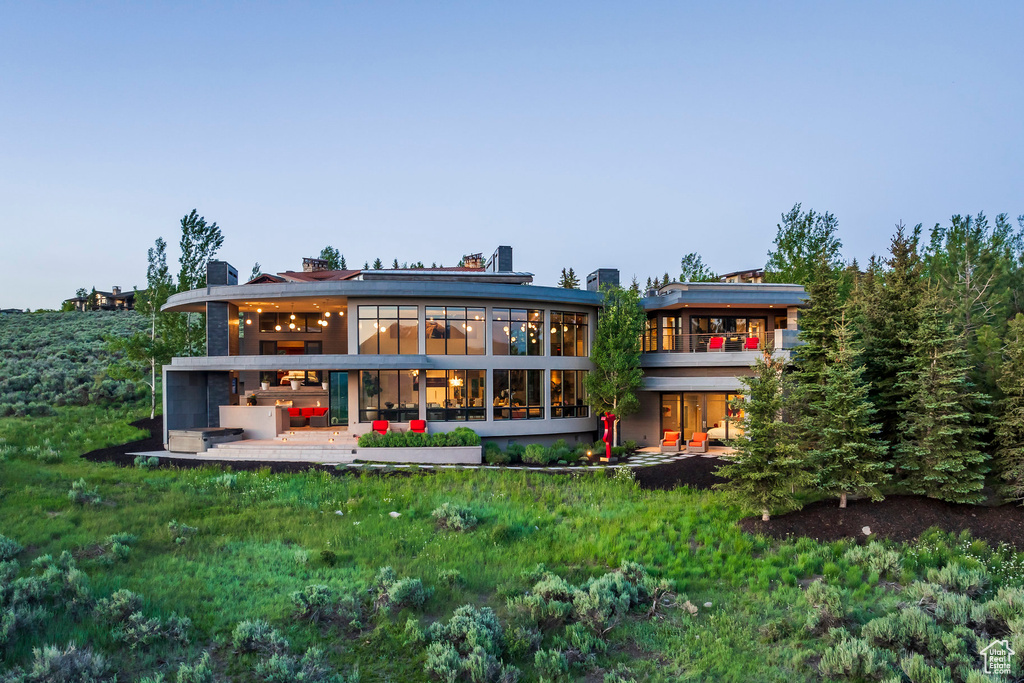 Back of house with a sunroom