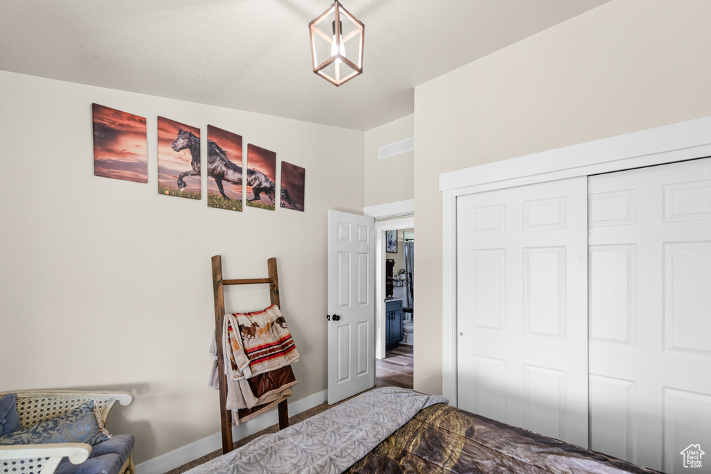 Bedroom with a closet and baseboards