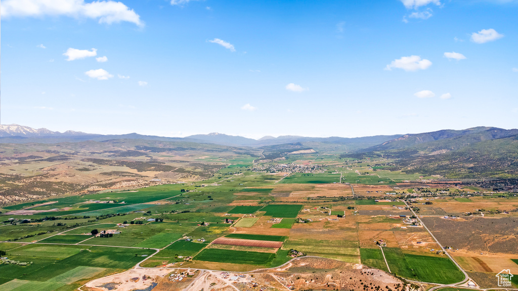 View of property location featuring a mountainous background and rural landscape