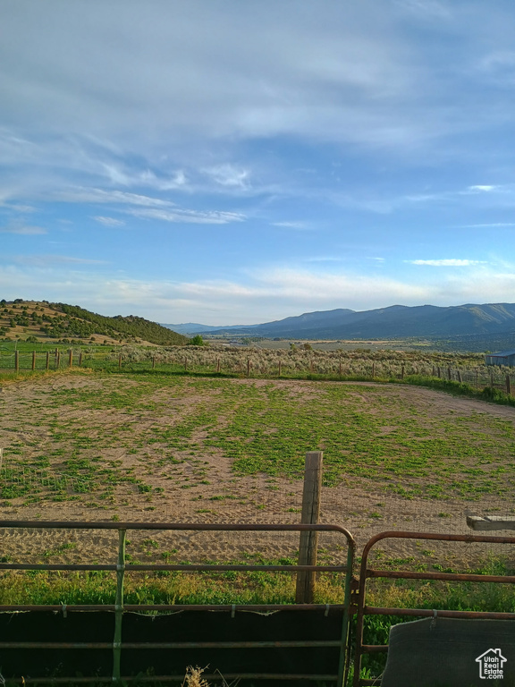 View of mountain background featuring rural landscape